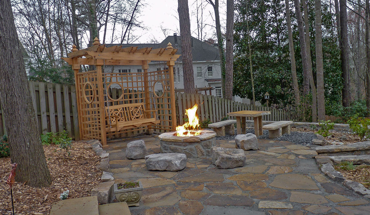 Outdoor makeover: Hardscaped backyard with wooden swing