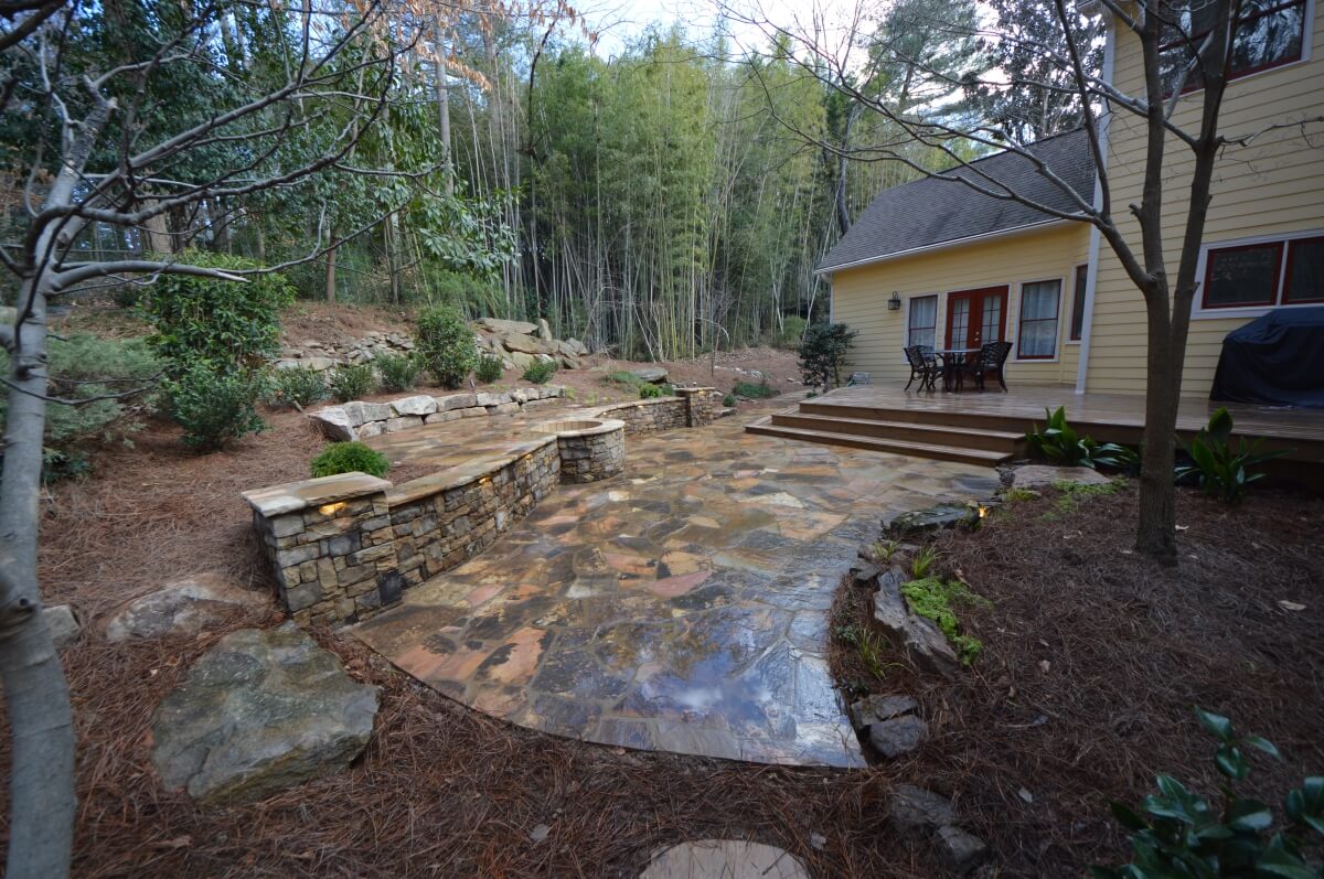 stone backyard living space with hardscape design