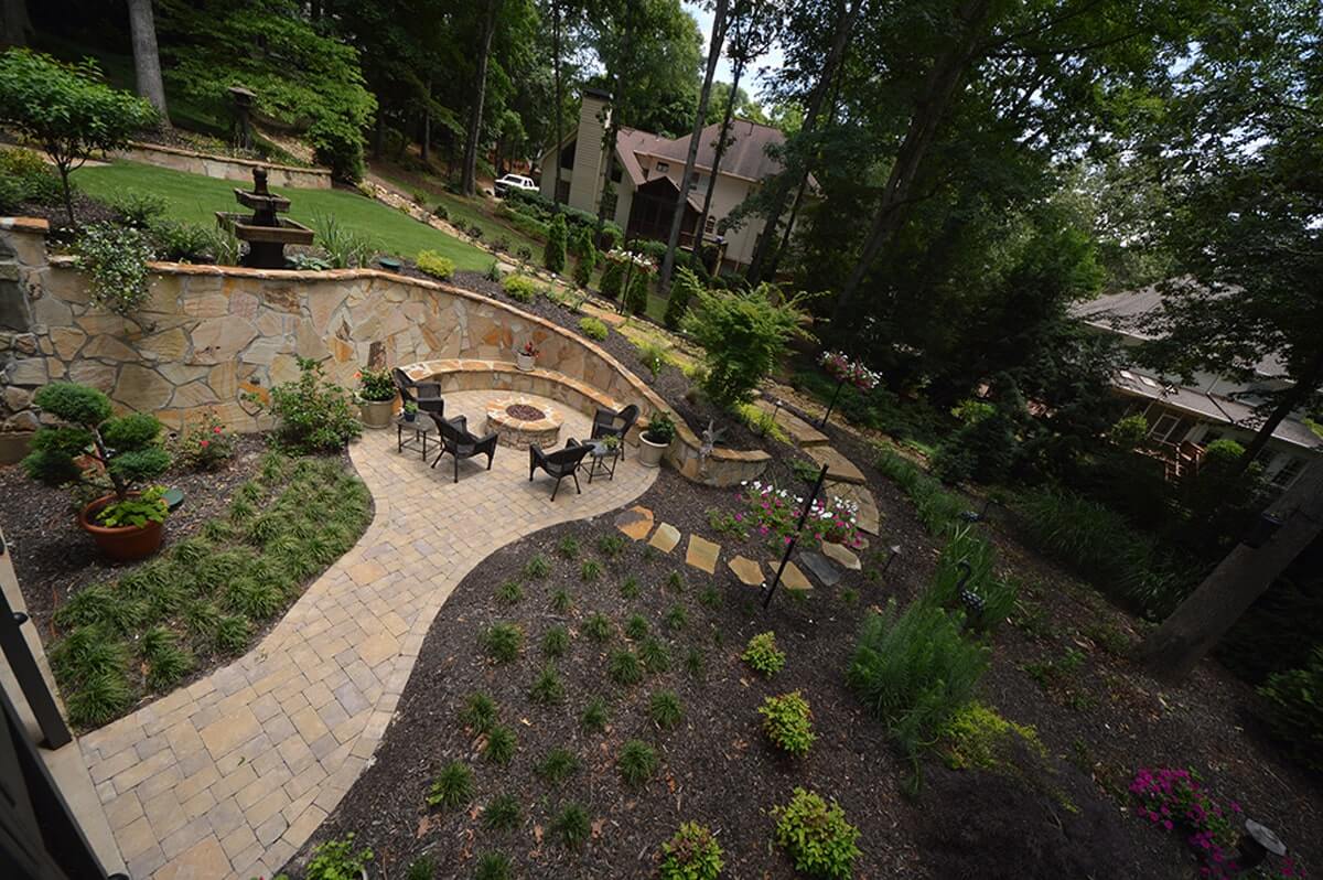 backyard with retaining wall and outdoor living space architecture