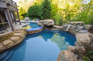 Scenic backyard pool with rocks